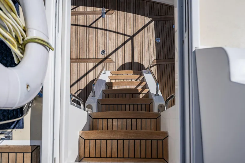 Slide: The Image of Staircase on 2006 Grand Banks 47 Europa yacht with teak decking and life preserver. - 29