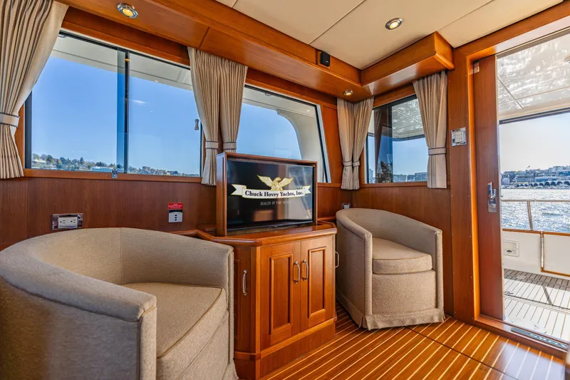 Slide: The Image of Luxurious interior of 2006 Grand Banks 47 Europa yacht with elegant seating and wood finishes. - 30