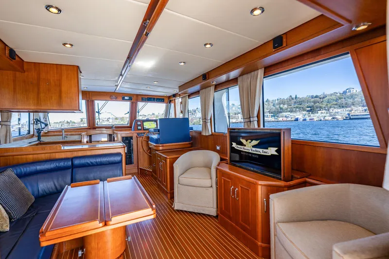 Slide: The Image of Luxurious interior of 2006 Grand Banks 47 Europa yacht with elegant wood finishes and waterfront view. - 32
