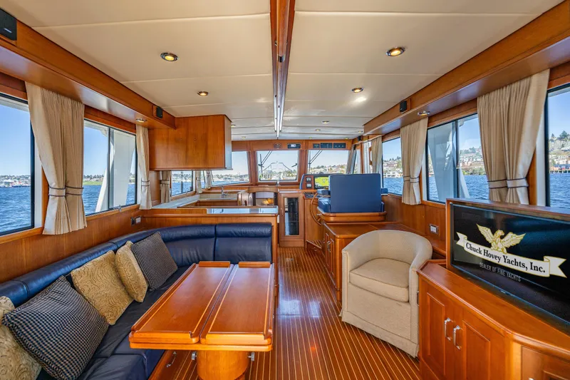 Slide: The Image of Luxurious interior of 2006 Grand Banks 47 Europa yacht with elegant wood finishes and comfortable seating. - 33