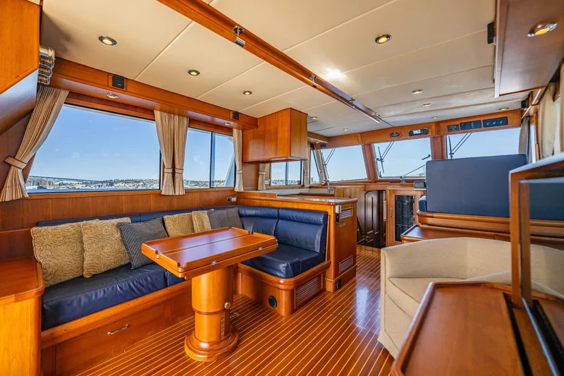 Slide: The Image of Luxurious interior of 2006 Grand Banks 47 Europa yacht with elegant wood finishes and seating. - 35