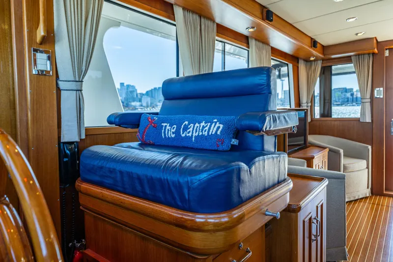 Slide: The Image of Luxurious interior of 2006 Grand Banks 47 Europa yacht with captain's chair and city view. - 41