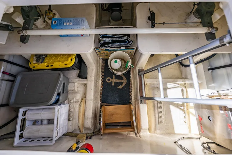 Slide: The Image of Engine room of 2006 Grand Banks 47 Europa yacht, featuring storage and maintenance equipment. - 46