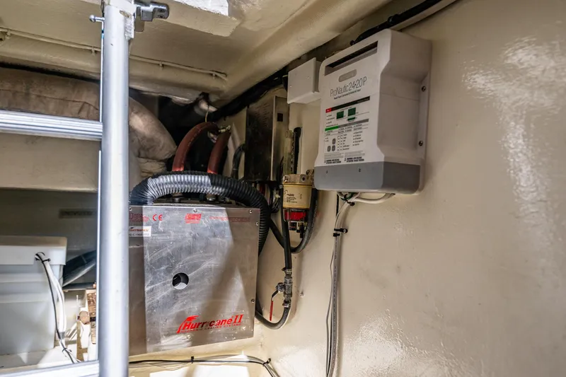 Slide: The Image of Engine room of 2006 Grand Banks 47 Europa with Hurricane II heating system and ProMariner charger. - 47