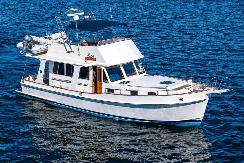 Slide: The Image of 2006 Grand Banks 47 Europa yacht cruising on open water. - 5