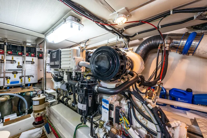 Slide: The Image of Engine room of 2006 Grand Banks 47 Europa yacht, featuring CAT marine power system. - 55