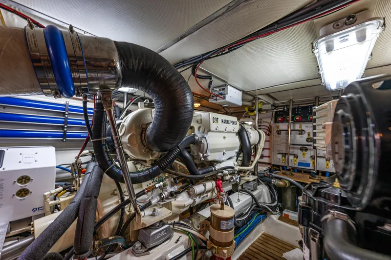 Slide: The Image of Engine room of 2006 Grand Banks 47 Europa yacht, featuring CAT marine power system. - 56