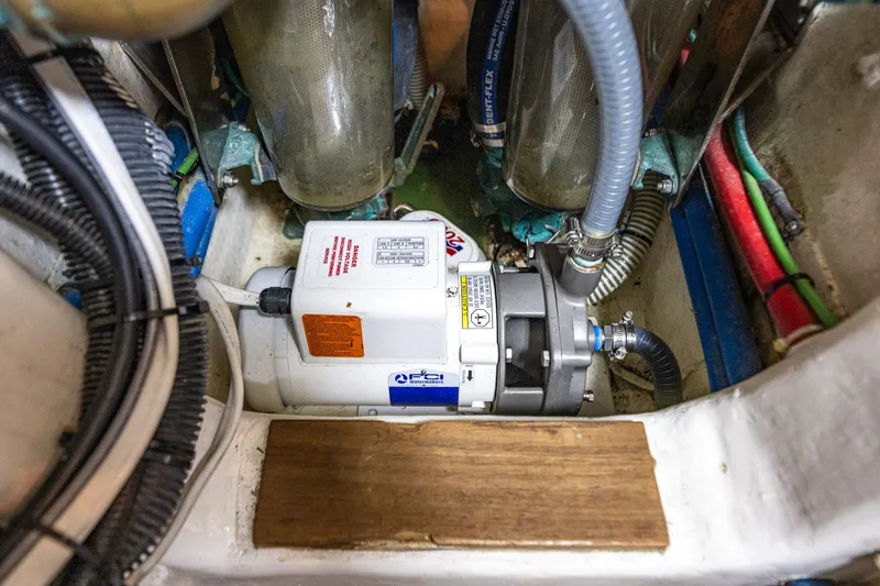 Slide: The Image of Engine room of 2006 Grand Banks 47 Europa with mechanical components and wiring. - 57