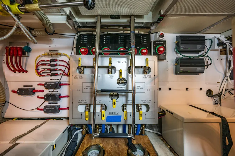 Slide: The Image of Engine room of 2006 Grand Banks 47 Europa, showcasing fuel management system and electrical components. - 58