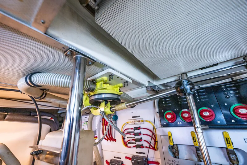 Slide: The Image of Engine room of 2006 Grand Banks 47 Europa, showcasing mechanical components and control panels. - 60