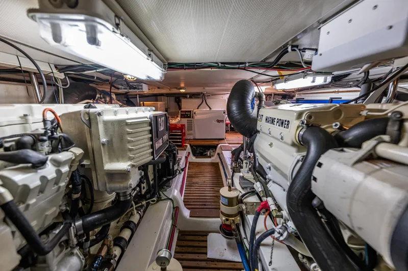 Slide: The Image of Engine room of 2006 Grand Banks 47 Europa yacht, featuring CAT marine power engines. - 61