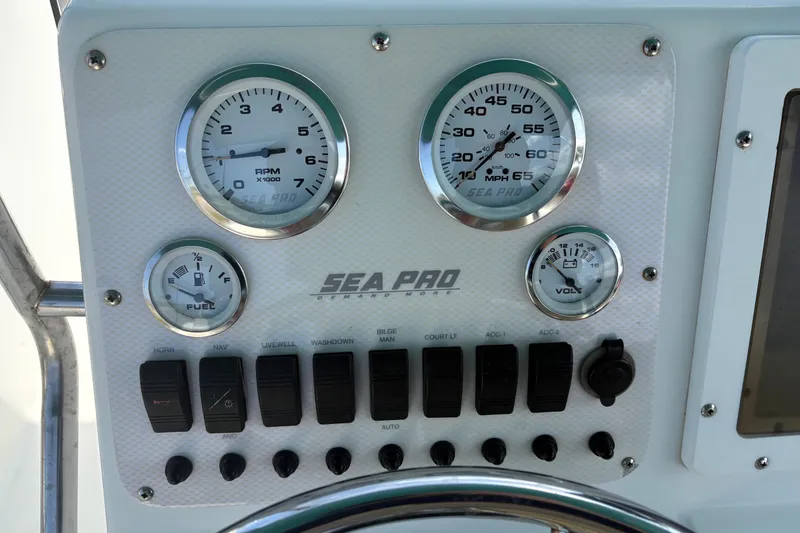 Slide: The Image of Dashboard of 2005 Sea Pro 190 Center Console boat with gauges and switches. - 15