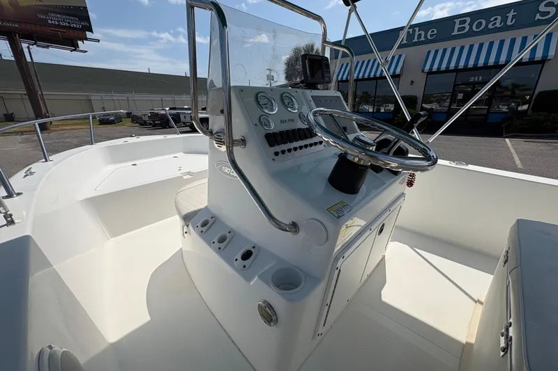 Slide: The Image of 2005 Sea Pro 190 Center Console boat interior with steering wheel and gauges. - 17