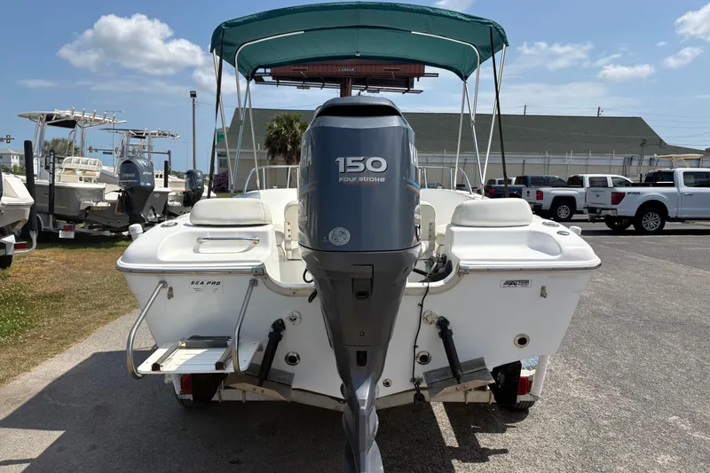 Slide: The Image of 2005 Sea Pro 190 Center Console boat with Yamaha 150 engine, parked outdoors. - 4