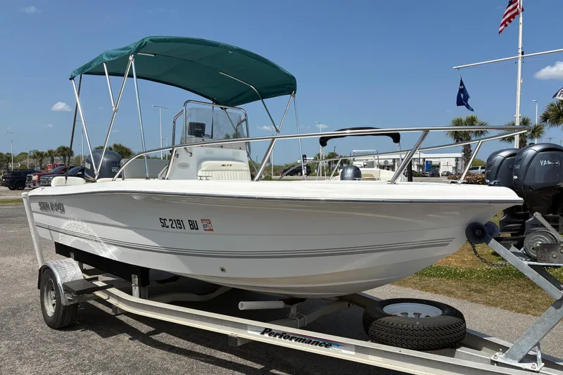 Slide: The Image of 2005 Sea Pro 190 Center Console boat on trailer with green canopy. - 7