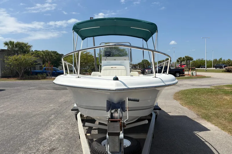 Slide: The Image of 2005 Sea Pro 190 Center Console boat on trailer with green canopy. - 8