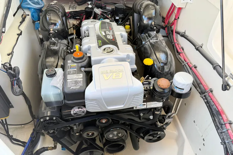 Slide: The Image of Engine compartment of a 2025 Sea Ray SLX 280 boat, featuring a big block V8 engine. - 29