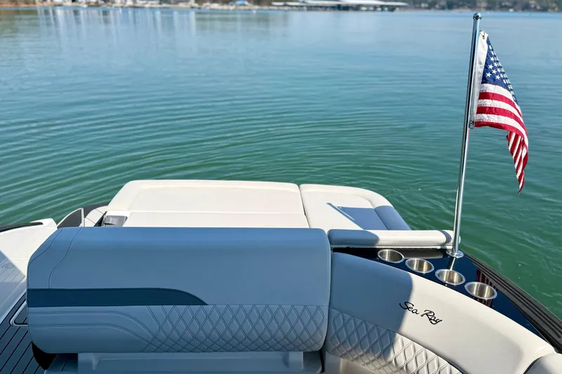 Slide: The Image of Rear view of 2025 Sea Ray SLX 280 yacht with American flag. - 30