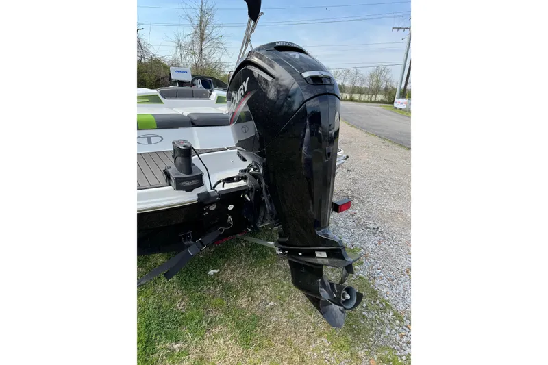 Slide: The Image of 2023 Tahoe T16 boat with Mercury outboard motor on grassy area. - 10