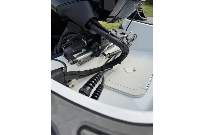 Slide: The Image of Close-up of 2023 Tahoe T16 boat engine components and wiring. - 12