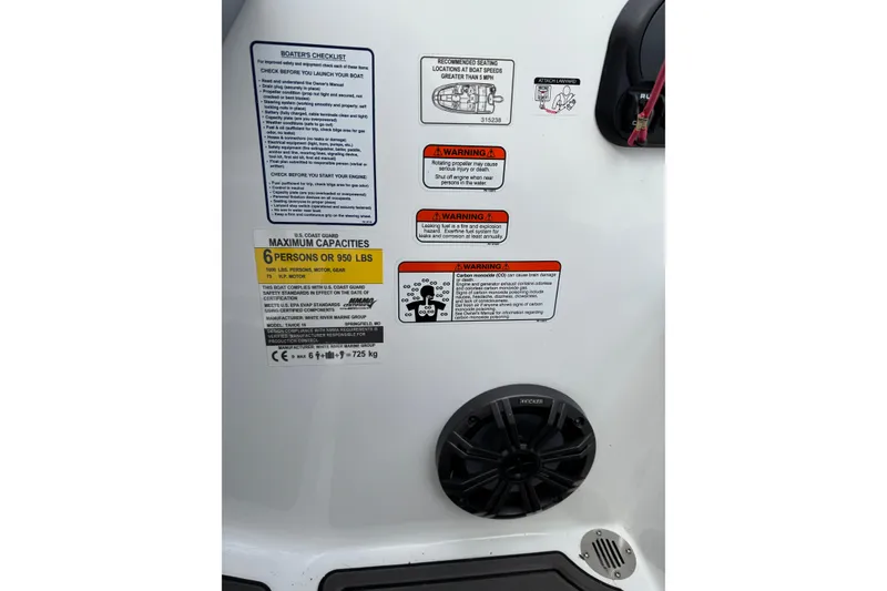 Slide: The Image of 2023 Tahoe T16 boat safety labels and speaker, highlighting capacity and warnings. - 6