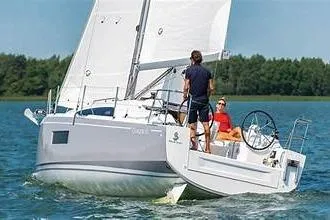 Slide: The Image of 2020 Beneteau Oceanis 30.1 sailing on a calm lake with two people onboard. - 1