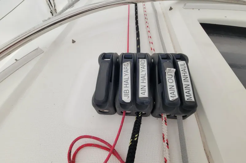 Slide: The Image of Close-up of rope clutches on a 2020 Beneteau Oceanis 30.1 sailboat deck. - 18