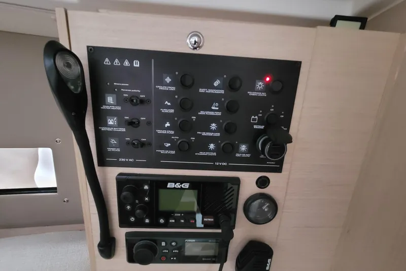 Slide: The Image of Control panel of a 2020 Beneteau Oceanis 30.1 yacht with navigation and communication equipment. - 31