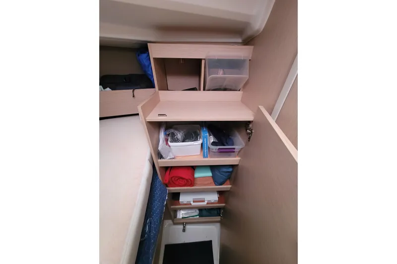 Slide: The Image of Interior storage shelves on a 2020 Beneteau Oceanis 30.1 sailboat, featuring organized compartments. - 35