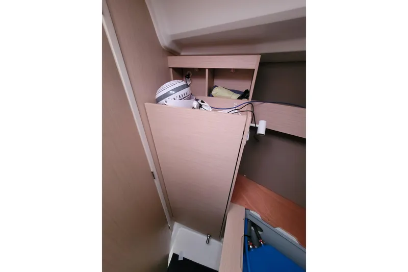 Slide: The Image of Interior storage space of 2020 Beneteau Oceanis 30.1 sailboat, featuring shelves and equipment. - 36