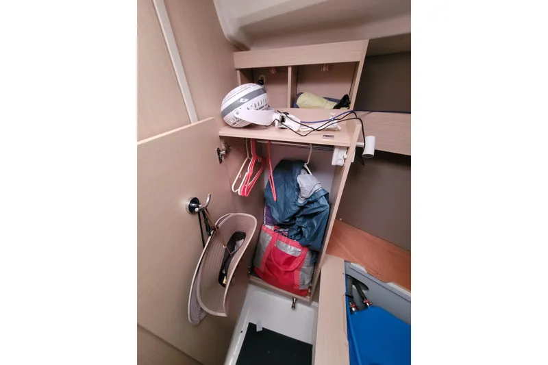 Slide: The Image of Interior storage space of a 2020 Beneteau Oceanis 30.1 sailboat, featuring organized compartments. - 37