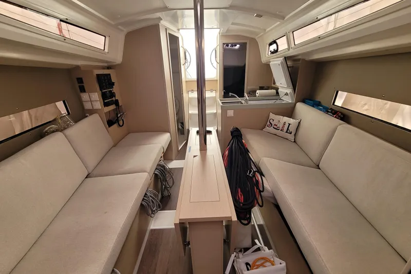Slide: The Image of Interior of 2020 Beneteau Oceanis 30.1 yacht, featuring cozy seating and modern amenities. - 39