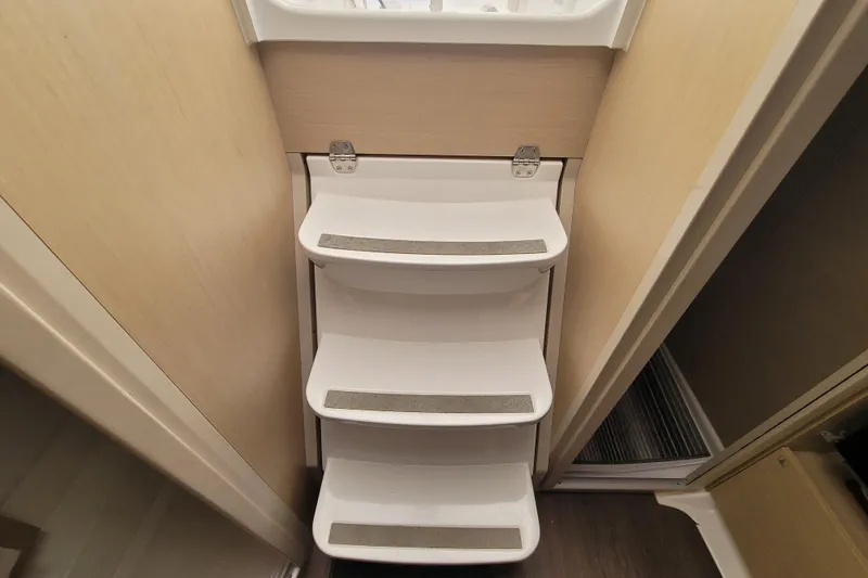 Slide: The Image of Interior steps of a 2020 Beneteau Oceanis 30.1 yacht, featuring non-slip surfaces. - 40