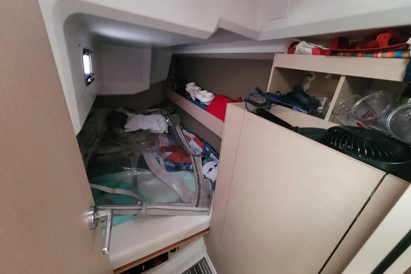 Slide: The Image of Interior cabin of a 2020 Beneteau Oceanis 30.1 yacht with storage and equipment. - 42