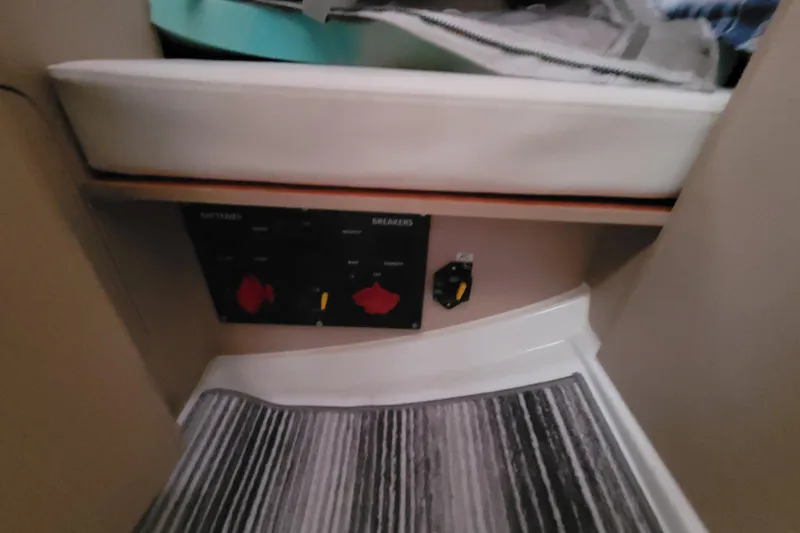 Slide: The Image of Interior view of a 2020 Beneteau Oceanis 30.1 yacht showing control panel and seating area. - 43