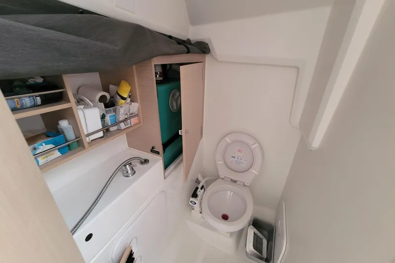 Slide: The Image of Compact bathroom in 2020 Beneteau Oceanis 30.1 yacht with sink and toilet. - 48