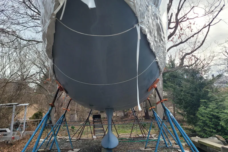 Slide: The Image of 2020 Beneteau Oceanis 30.1 sailboat on stands, wrapped for winter storage. - 5