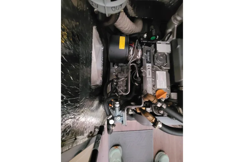 Slide: The Image of Engine compartment of a 2020 Beneteau Oceanis 30.1 sailboat, showcasing mechanical components. - 50