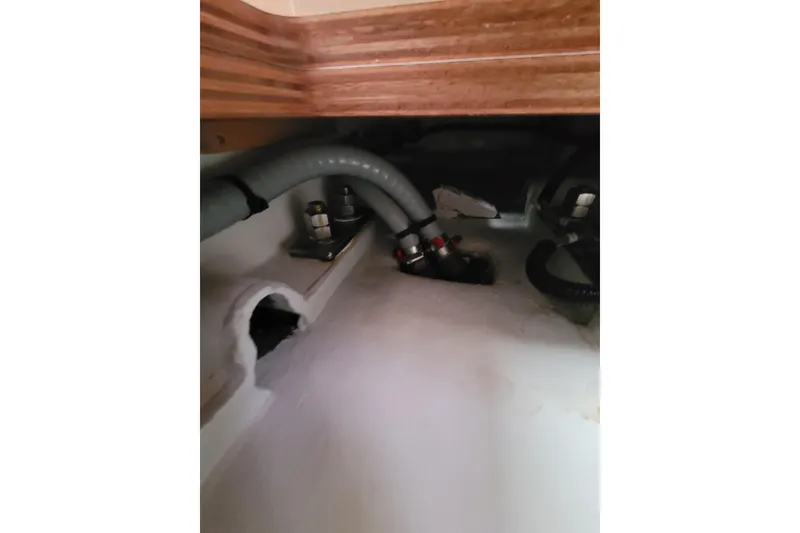 Slide: The Image of Interior view of 2020 Beneteau Oceanis 30.1 yacht showing plumbing and fittings. - 57