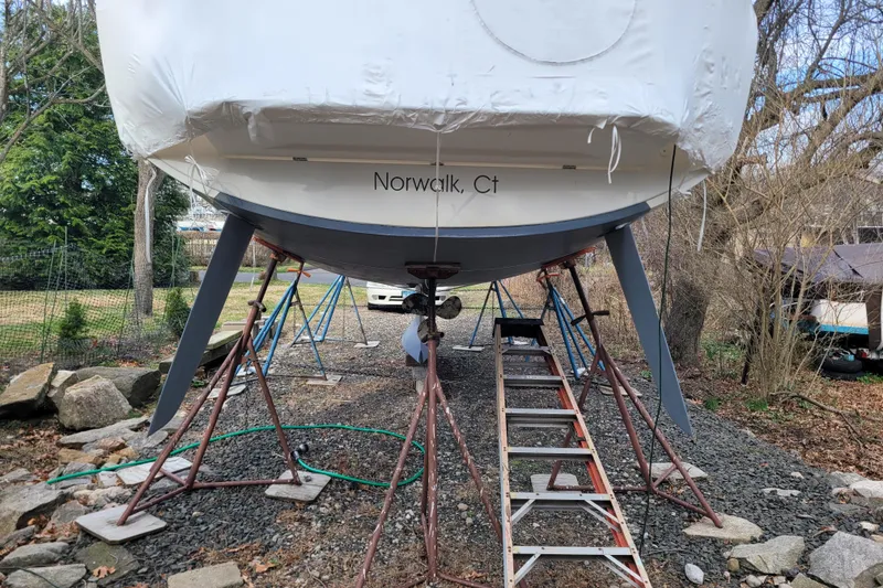 Slide: The Image of Beneteau Oceanis 30.1 sailboat in Norwalk, CT, on stands for maintenance. - 7