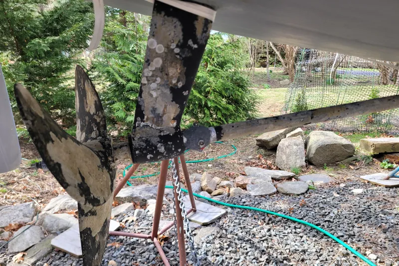 Slide: The Image of Propeller of a 2020 Beneteau Oceanis 30.1 sailboat, showing wear and marine growth. - 8