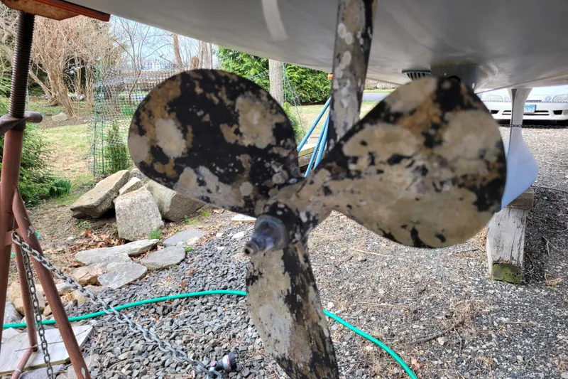Slide: The Image of Propeller of a 2020 Beneteau Oceanis 30.1 sailboat, showing wear and marine growth. - 9