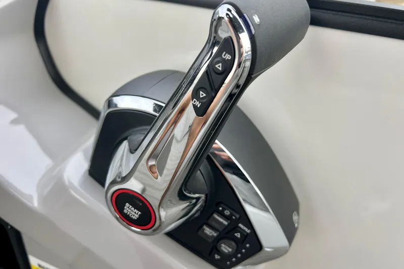 Slide: The Image of Close-up of the throttle lever on a 2025 Harris Sunliner 230. - 17