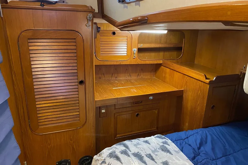 Slide: The Image of Cozy cabin interior of 1988 Hylas 42 yacht with Dickinson heater and two travel mugs. - 11