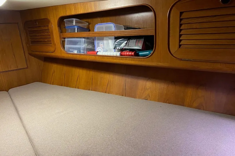 Slide: The Image of Cozy cabin interior of a 1988 Hylas 42 yacht with wooden furnishings. - 16
