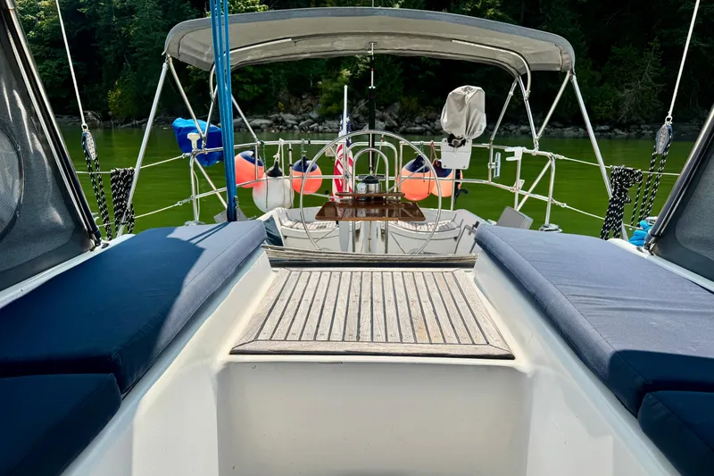 Slide: The Image of Cozy cabin interior of a 1988 Hylas 42 yacht with wooden storage and cushioned seating. - 18