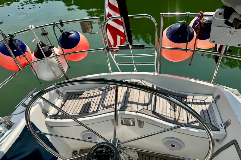 Slide: The Image of Cozy cabin interior of a 1988 Hylas 42 sailboat with cushioned V-berth. - 19