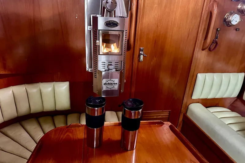 Slide: The Image of Luxurious 1988 Hylas 42 yacht interior with wood finish and comfortable seating. - 7