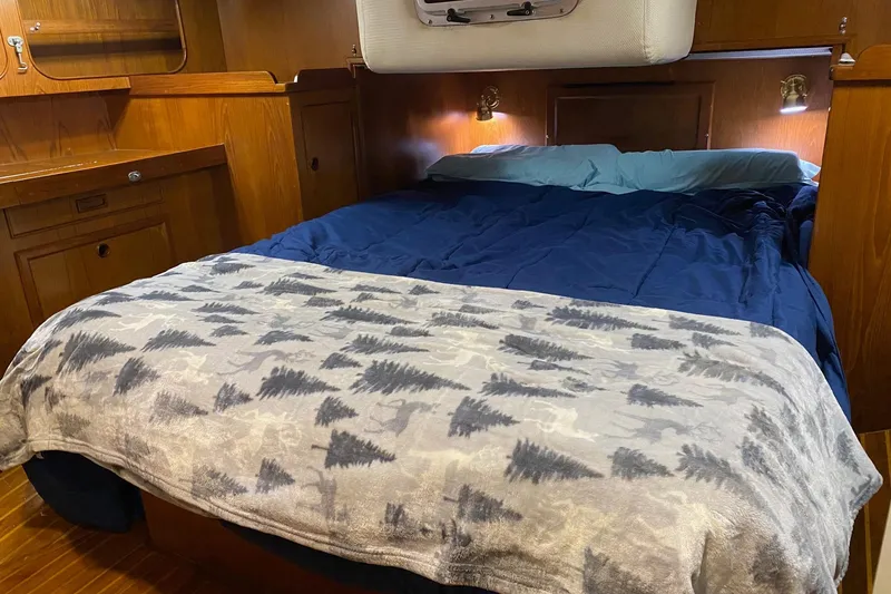Slide: The Image of Luxurious 1988 Hylas 42 yacht interior with wooden finishes and comfortable seating. - 8