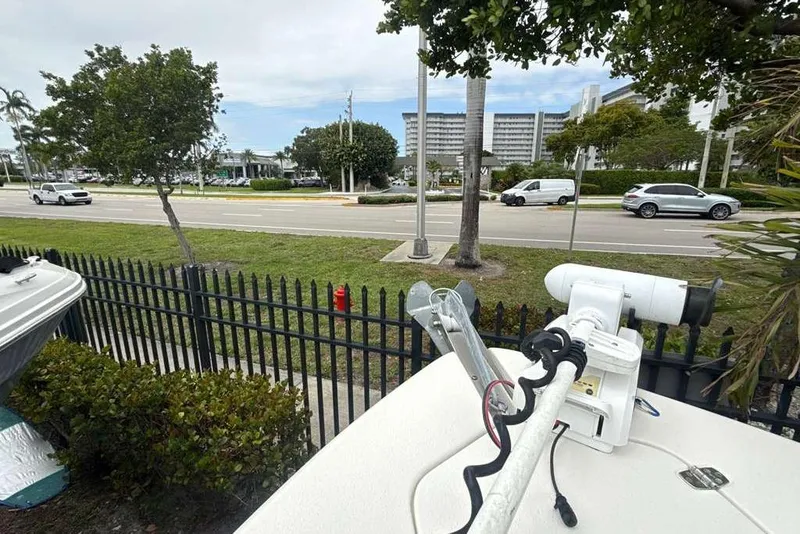 Slide: The Image of 2017 Sea Chaser 24 HFC boat parked near a road with passing vehicles. - 12